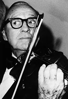 Violin Prints: Jack Benny American comedian playing violin January 1971 A©mirrorpix