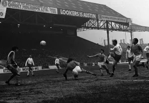 Jack Charlton Leeds centre half hammers the ball past Man City