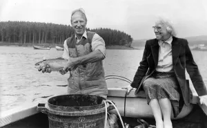 00087 Prints: Jack Charlton releases one of the tagged trout at Kielder Reservoir with his mam Cissie