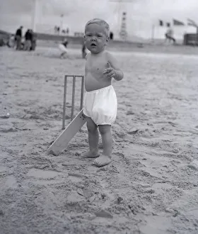 00190 Prints: The next Jack Hobbs stands at the crease ready to bat in a game of beach cricket