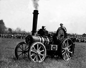 Vintage Prints: Jack Makepeace, Junior, drives his vehible puffing past obstacles in a race
