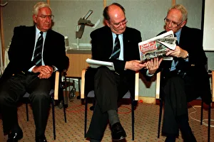 Ct Gash Prints: Jack McGinn Celtic football director sitting in chair showing Dazily Record to Bill
