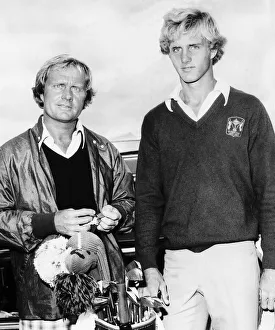 Jack Nicklaus Jnr standing beside his father in front of a set of golf clubs casualy