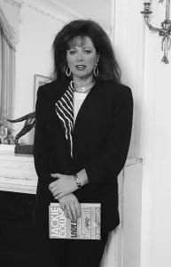 Ne022 Prints: Jackie Collins in a London Hotel Mirrorpix with her latest novel Lady Boss
