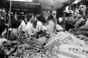 Market Stalls Prints: Jackie Pullinger seen here shopping in the market place of the Walled City in Hong Kong