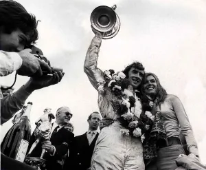 JACKIE STEWART ex World Champion RACING DRIVER WITH WIFE HELEN Stewart AFTER HE WON