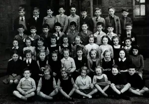 Jackie Stewart pictured as young boy in a school group photograph in Dumbarton