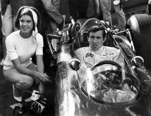 Jackie Stewart and his wife Helen in his B. R. M. seen here on practice day for the 1966