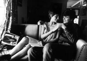 Hugging Prints: Jacqueline Bisset actress with Canadian actor Michael Sarrazin in the living room of her