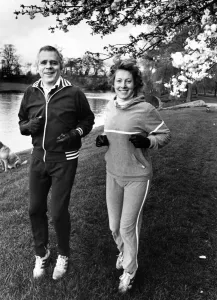 Exercise Prints: Jaguar boss Mr John Egan sets out on a morning run with his wife Julia. 23rd April 1983