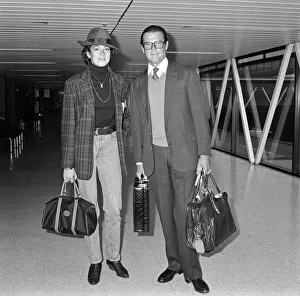00946 Prints: James Bond star Roger Moore turned up in another role today - as a devoted father