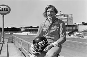 Race Track Prints: James Hunt, (British racing driver) poses for camera before he tests his Hesketh car