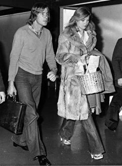 Racing Collection: James Hunt with girlfriend Jane Birbeck at Heathrow Airport after returning from Canada