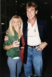 Racing Collection: James Hunt racing driver with arm around Helen Dyson