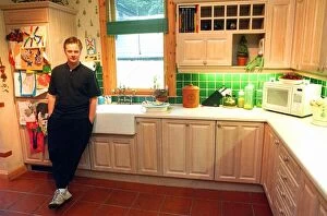 Images Dated 4th March 1997: James MacPherson actor in Taggart Standing in his kitchen March 1997