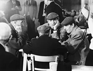 James Mason Actor talking to some down and outs at a Salvation Army hostel