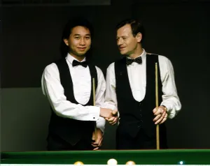 James Wattana Snooker Player shaking hands with Alex Higgins