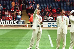 White Suit Prints: Jamie Redknapp (left) waves to the crowd as Ian Rush looks on during the pre-match