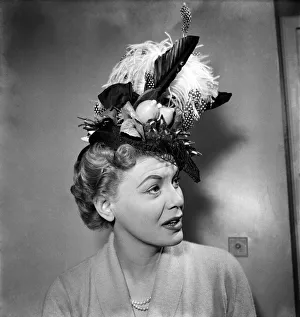 00021 Prints: Jane Morgan In crazy hats she would like to wear. April 1953 D1685
