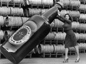 Janette Harper with a Giant Newcastle Brown Ale Bottle 1977