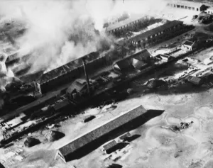 Japanese barracks on Tokushima airfield in Japan being bombed by the British Navy