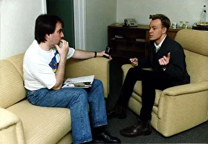 Australian Prints: Jason Donovan being interviewed black jeans jacket sitting in armchair ankle boots