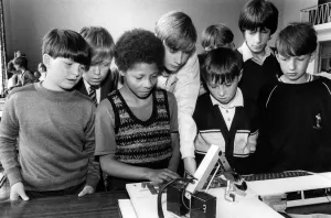Middlesbrough Prints: Jason Kamara (third left) operates a computer controlled robot watched by (left to right