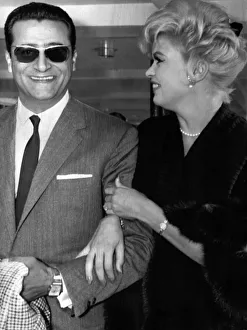 Jayne Mansfield at Prestwick Airport in Scotland with Italian film producer Enrico Bomba