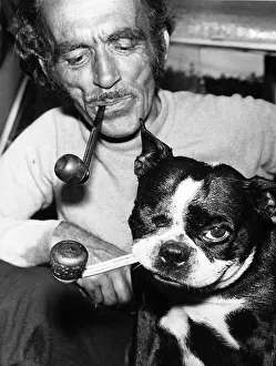 Weird Prints: Jean Morel and his dog Butch a Boston Bull Terrier smoke their pipes at home in Devon