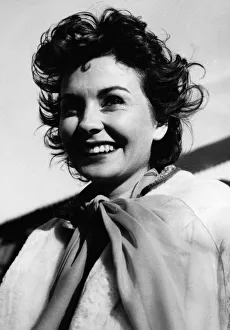 1950s Fashion Prints: Jean Simmons actress age 25 on arrival at Heathrow airport October 1954