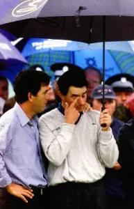 Upset Prints: Jean Van De Velde is consoled as he waits at the winners presentation at Carnoustie