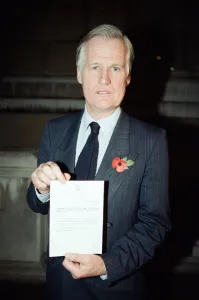 Resign Prints: Jeffrey Heard MP holds a notice from the House of Commons regarding the resignation of