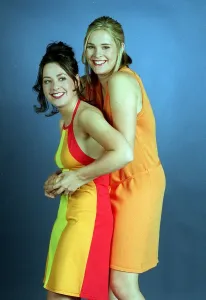 Jenni Falconer tv presenter with her friend Vicki Simpson Red yellow dress