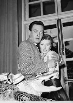 Reptiles Prints: Jennie Carson and Donald Sinden during filming An Alligator Named Daisy. 27th April 1955