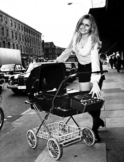 Weird Prints: Jenny Caroline Goodman demonstrating the Raleigh Dreamline Special Pram outside the Ideal