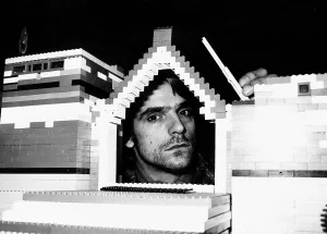 Relief Prints: Jeremy Irons Actor with his head inside model house built from lego bricks which was used