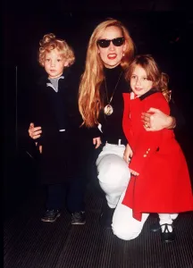 Jerry Hall model with children Elizabeth Scarlet and James at Heathrow airport leaving