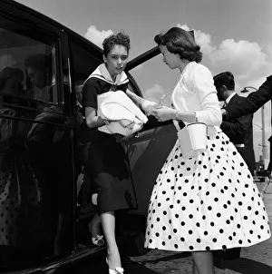 Young Prints: Jerry Lee Lewis and his 13-year-old wife Myra (left) at London Airport to fly home