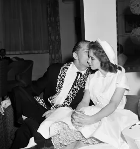 01319 Prints: Jerry Lee Lewis and his 13-year-old wife Myra at the Westbury Hotel, London