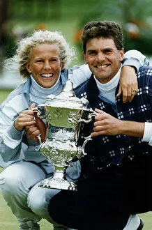 Colour Prints: Jesper Parnevik and unidentified woman holding up trophy golf