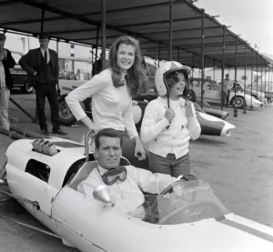 Man Woman And Child Prints: Jessica Walter with actor James Garner in a Maclaren sports car which has been painted