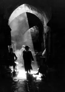 A Jewish Rabbai returning from the wailing wall through the Arab city in Old Jeruselem