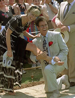 Images Dated 8th July 1997: Jill Dando and Sir Cliff Richard - July 1997 Jill Dando TV Presenter cools her feet then