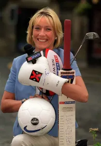 Jill Douglas TV Presenter 1999 who has joined Sky TV holding bat ball golf club