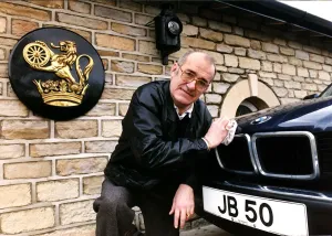 01159 Prints: Jim Bowen Comedian / TV Presenter polishing his BMW car