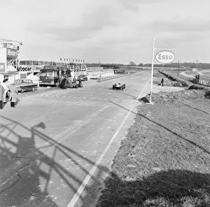 Jim Clark speeds down the pit straight during trials in is new Lotus 33 at Snetterton