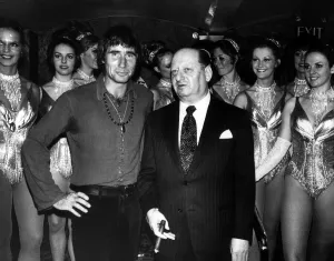 00148 Prints: Jim Dale comedian actor with Sir Lew Grade and the Tiller girls August 1973