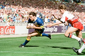 Jim Fallon avoids the Wigan defence to score a try for Leeds during the Rugby League Cup