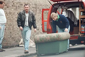 Jim Hutton, former hairdresser, dressed in leather jacket walking towards the camera