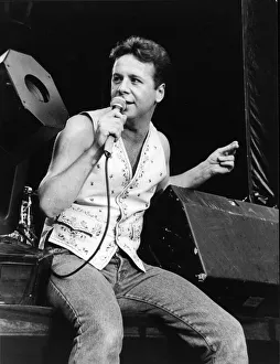 Jim Kerr, lead singer of the rock group Simple Minds entertains the crowd at the groups